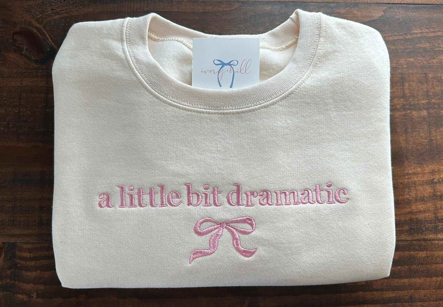 ‘a little bit dramatic’ bow sweatshirt