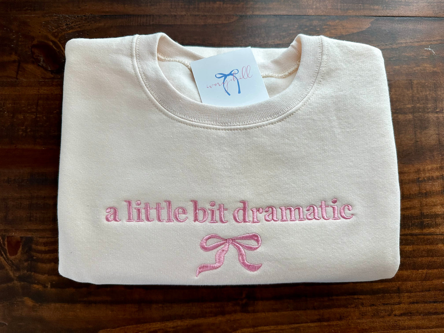 ‘a little bit dramatic’ bow sweatshirt