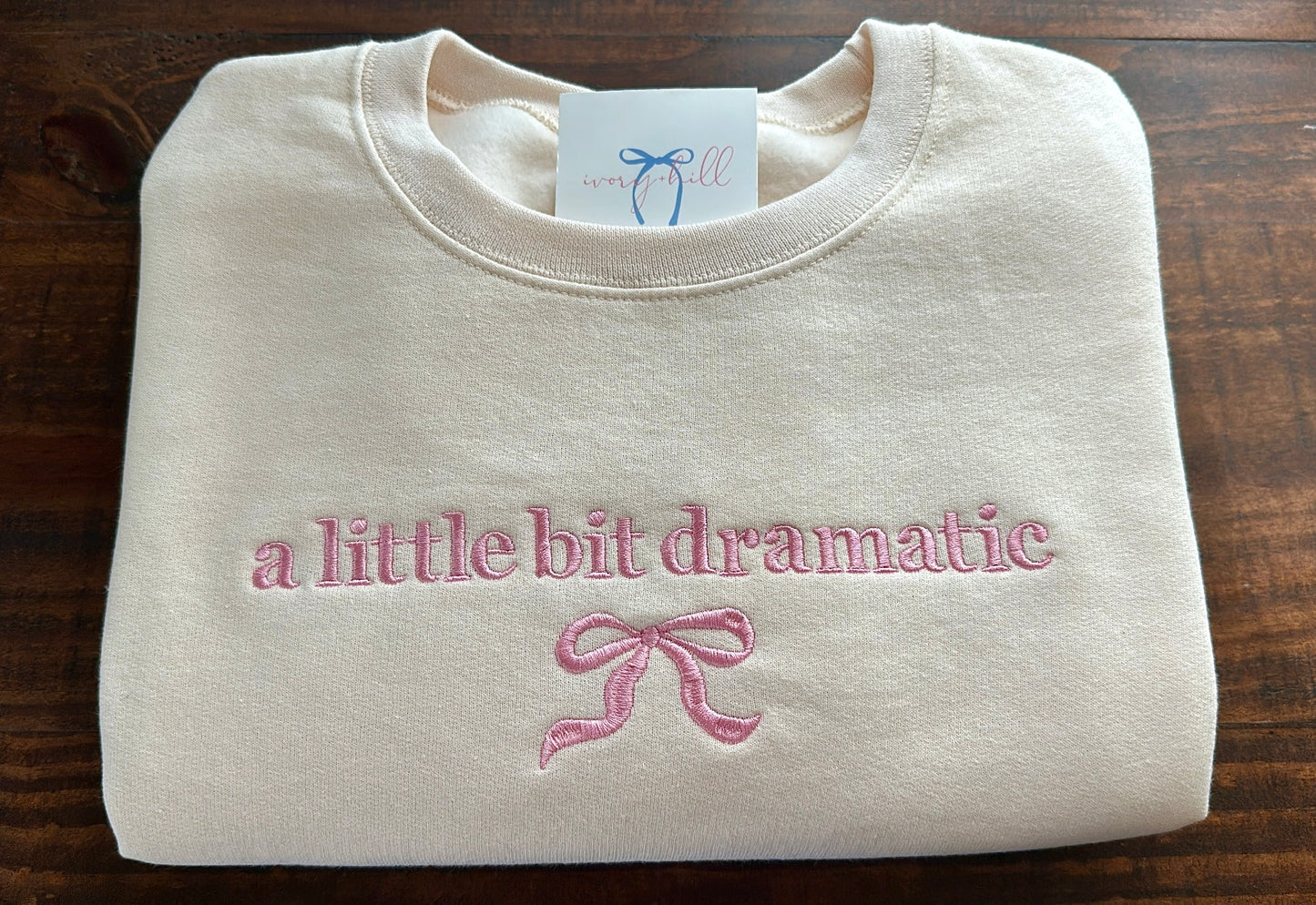 ‘a little bit dramatic’ bow sweatshirt